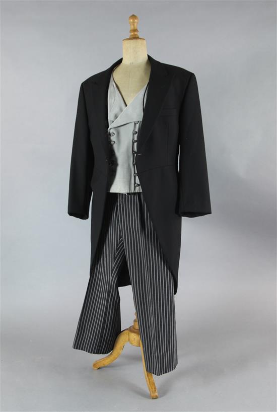 A collection of seven black morning jackets, seventeen stripe trousers and ten mostly grey waistcoats